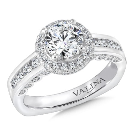 A modern take on the halo engagement ring set in 14k white gold.