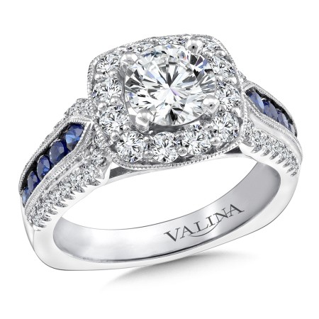 Diamond and sapphire halo style engagement ring set in 14k white gold.