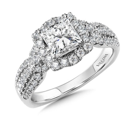 This princess center stone is embellished with a vintage-inspired, curvy cushion halo. From the halo, diamonds flow a third of the way down the shank. R1060W